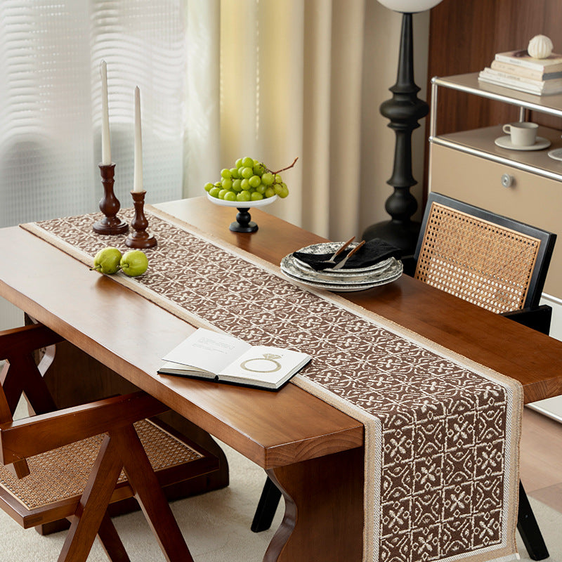 Decorative table runner with woven ornament jacquard and finely hemmed edges Kalsten
