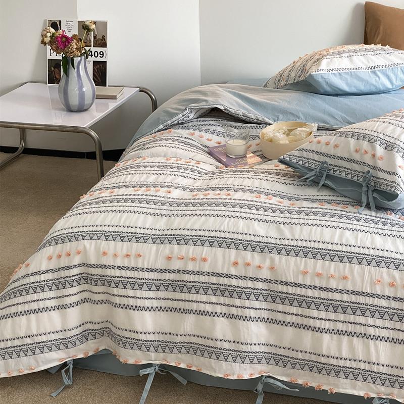 Striped bedding set made of cotton percale with embroidery dots and ties