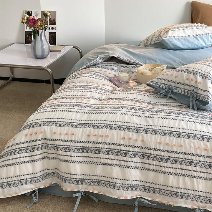 Striped bedding set made of cotton percale with embroidery dots and ties