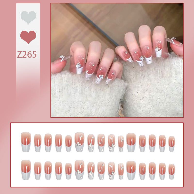 Nail art set with elegant wave patterns and delicate pearl accents Kalsten