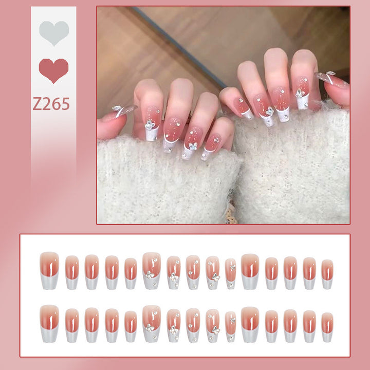 Nail art set with elegant wave patterns and delicate pearl accents Kalsten
