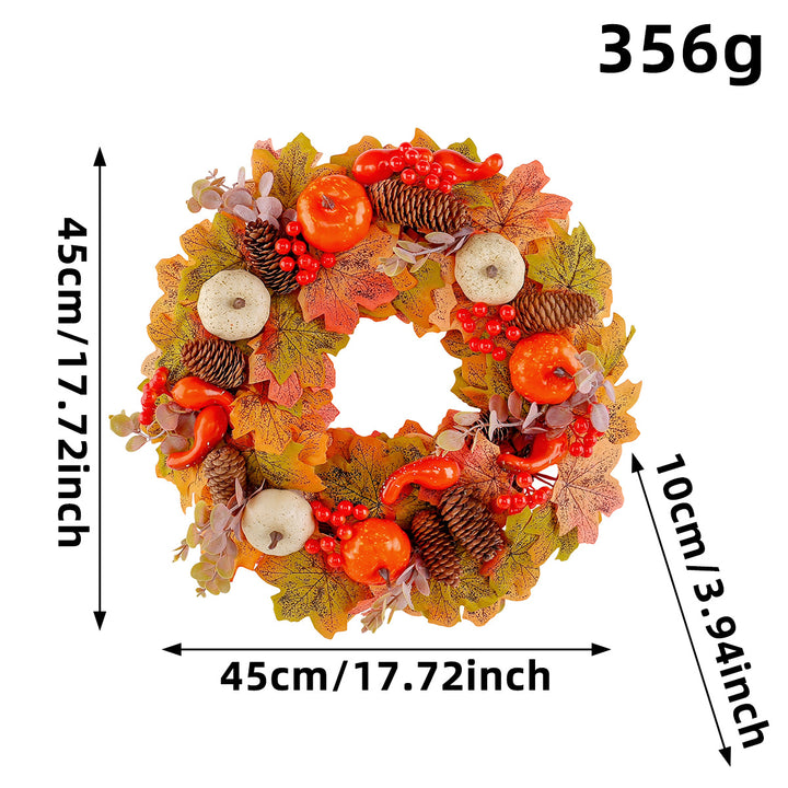 Autumn door wreath with artificial maple leaves, cones, and decorative pumpkins