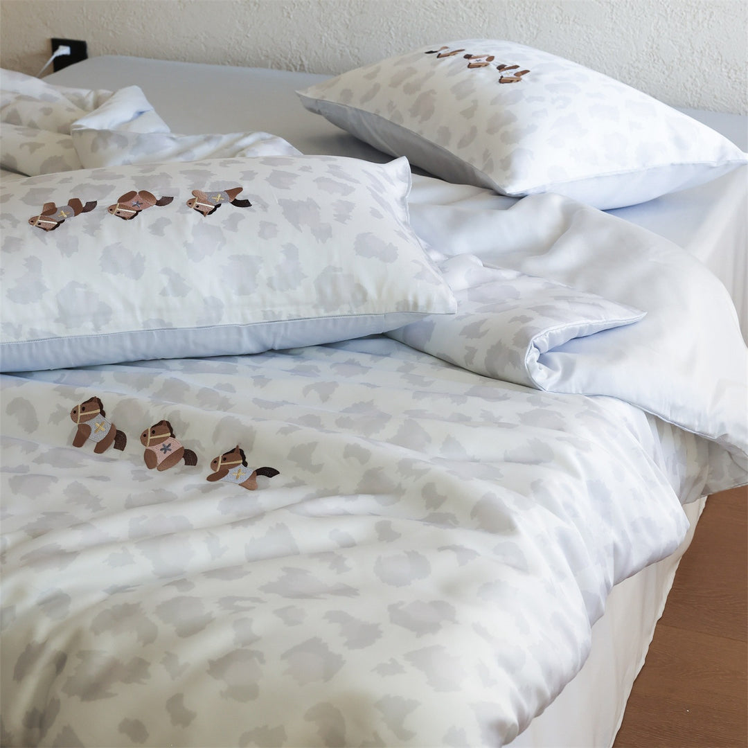 Bedding set with subtle leopard texture and embroidered horse motifs