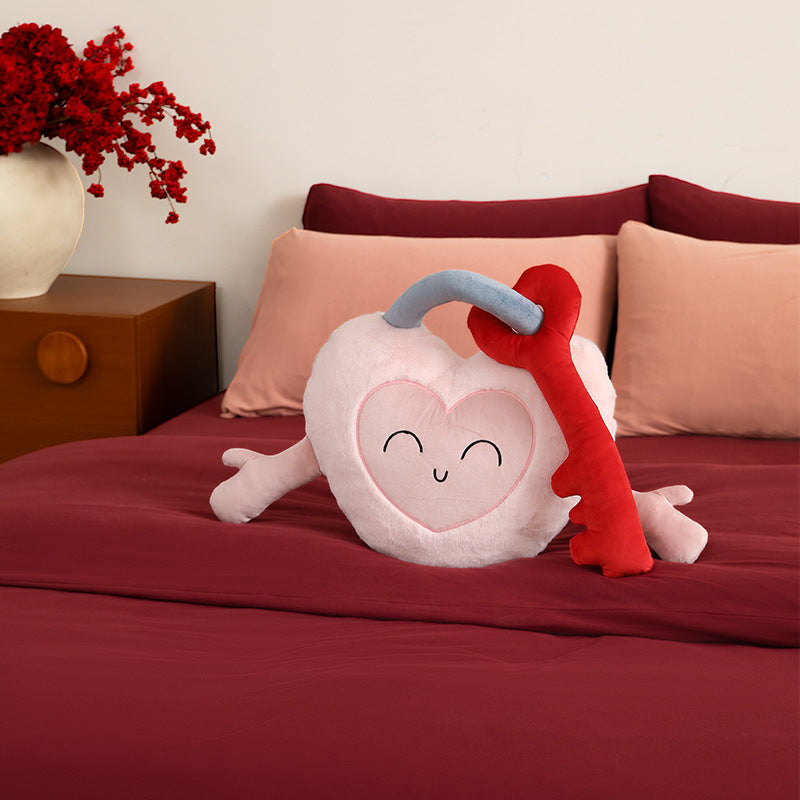Plush heart cuddle pillow with sewn-on key motif and cute embroidered face Kalsten