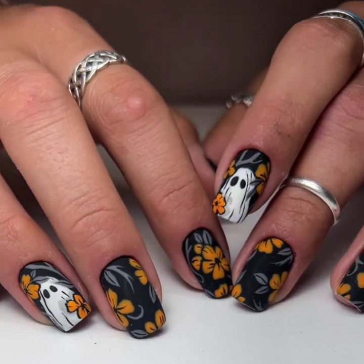 Acrylic nail set with spooky ghost design and floral accents Kalsten