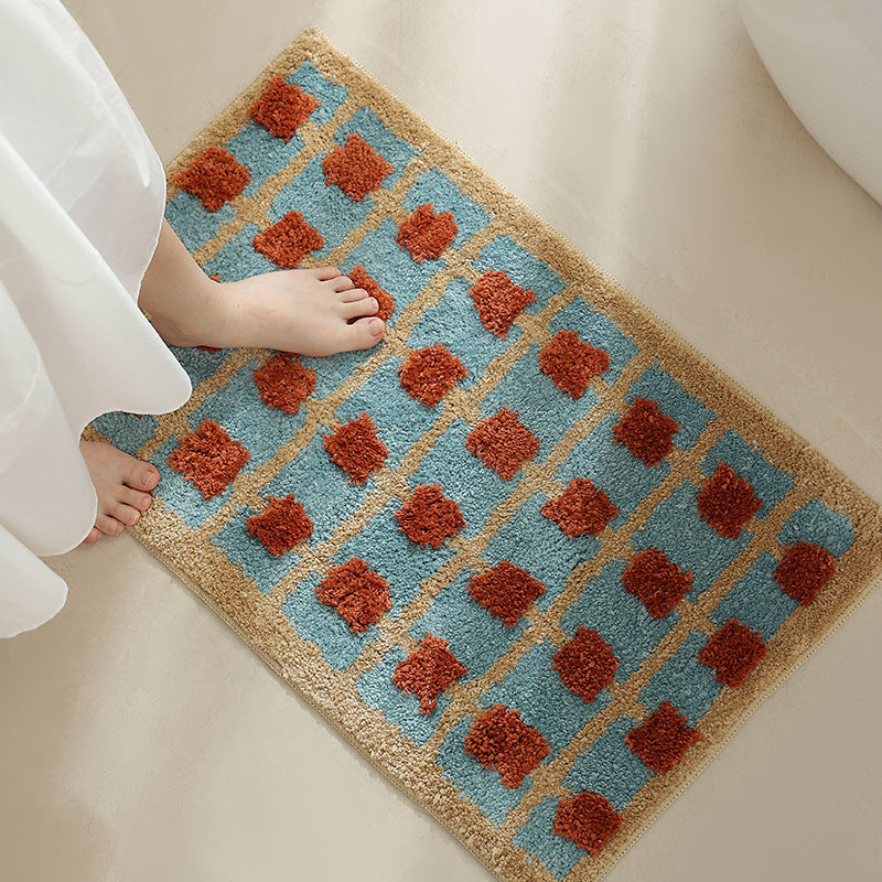 Hand-tufted bathroom bath mat with non-slip backing and textured square relief Kalsten