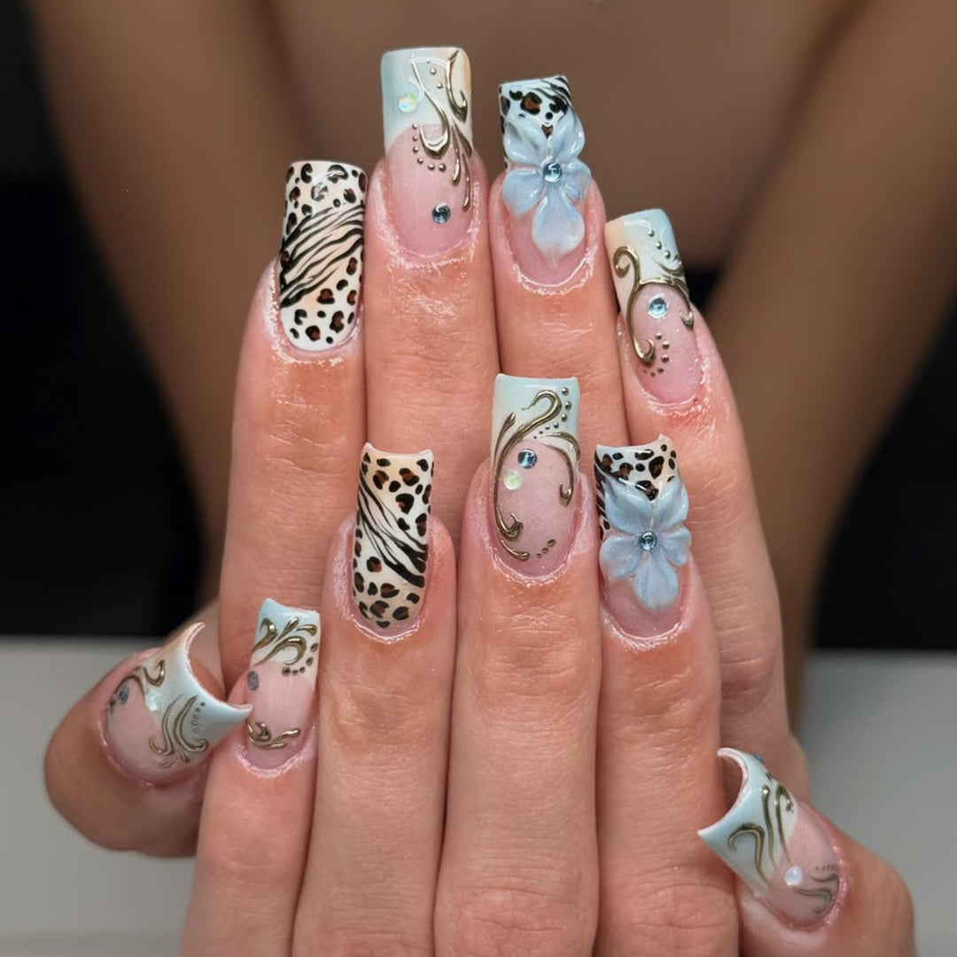 Glamorous artificial nail set with floral accents and glitter details Kalsten