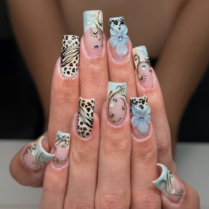 Glamorous artificial nail set with floral accents and glitter details Kalsten