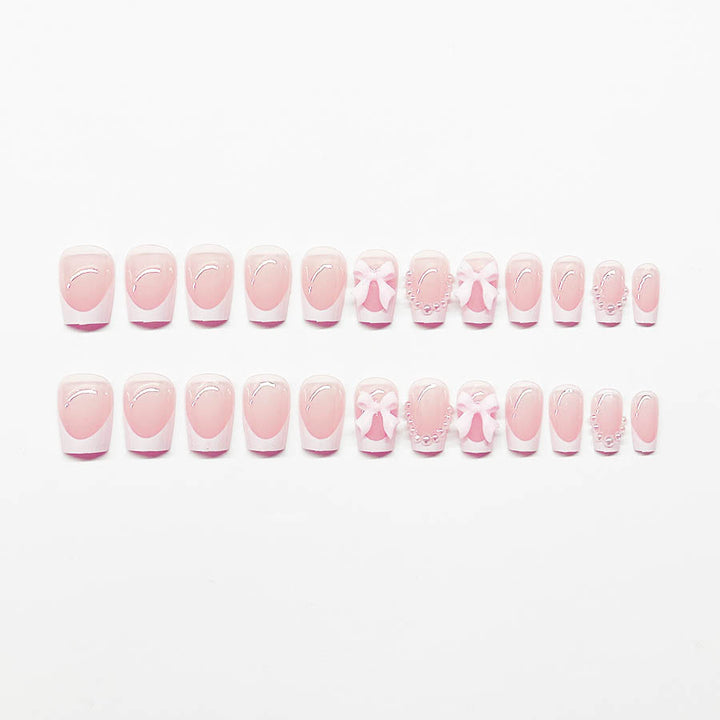 Artificial nails with elegant bows and pearl embellishments Kalsten