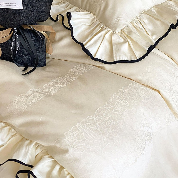 Noble cotton satin bedding set with flounce ruffles, jacquard floral border and contrasting piping.