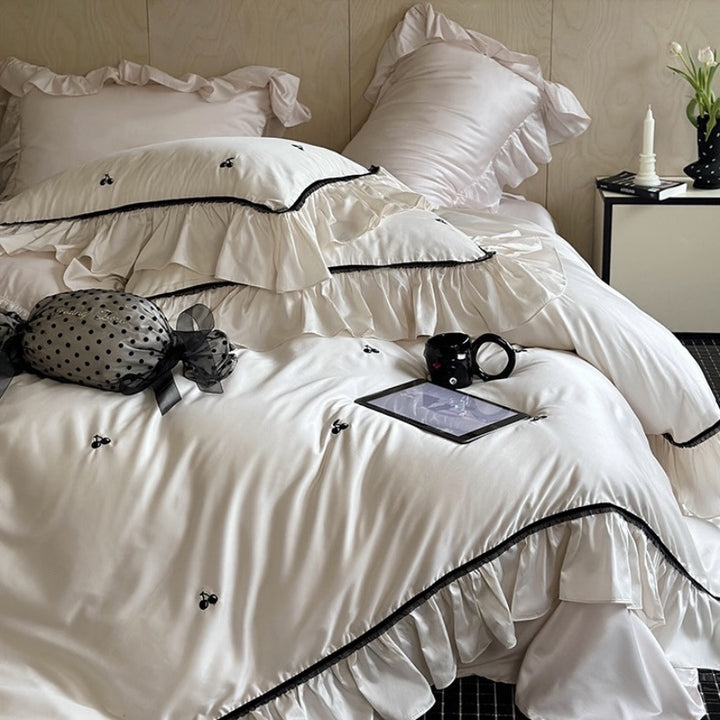Silk-gloss satin bedding set with ruffled trim and delicate cherry embroidery