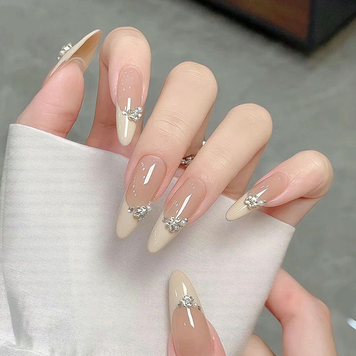 Acrylic nail set with elegant tips and sparkling appliqués Kalsten