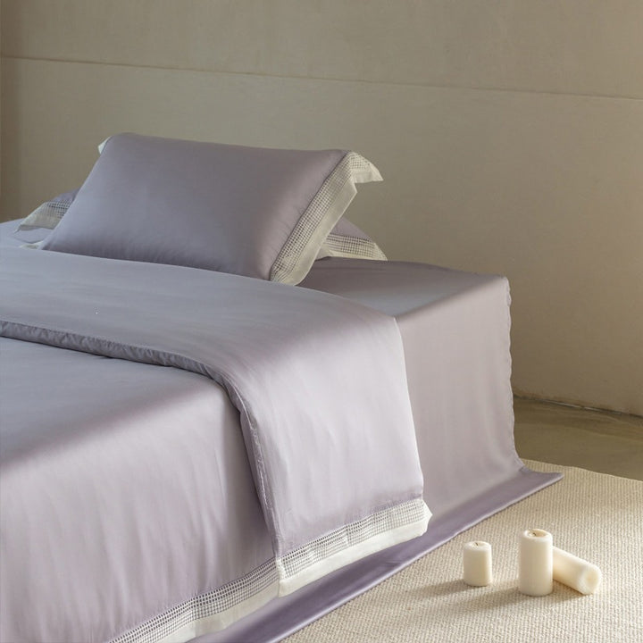 Elegant bedding set with lace grid trim and hotel closure