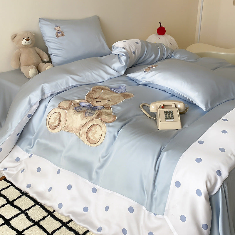 Reversible satin bedding set for children with a large watercolor teddy, polka dot border, and silky-matte finish