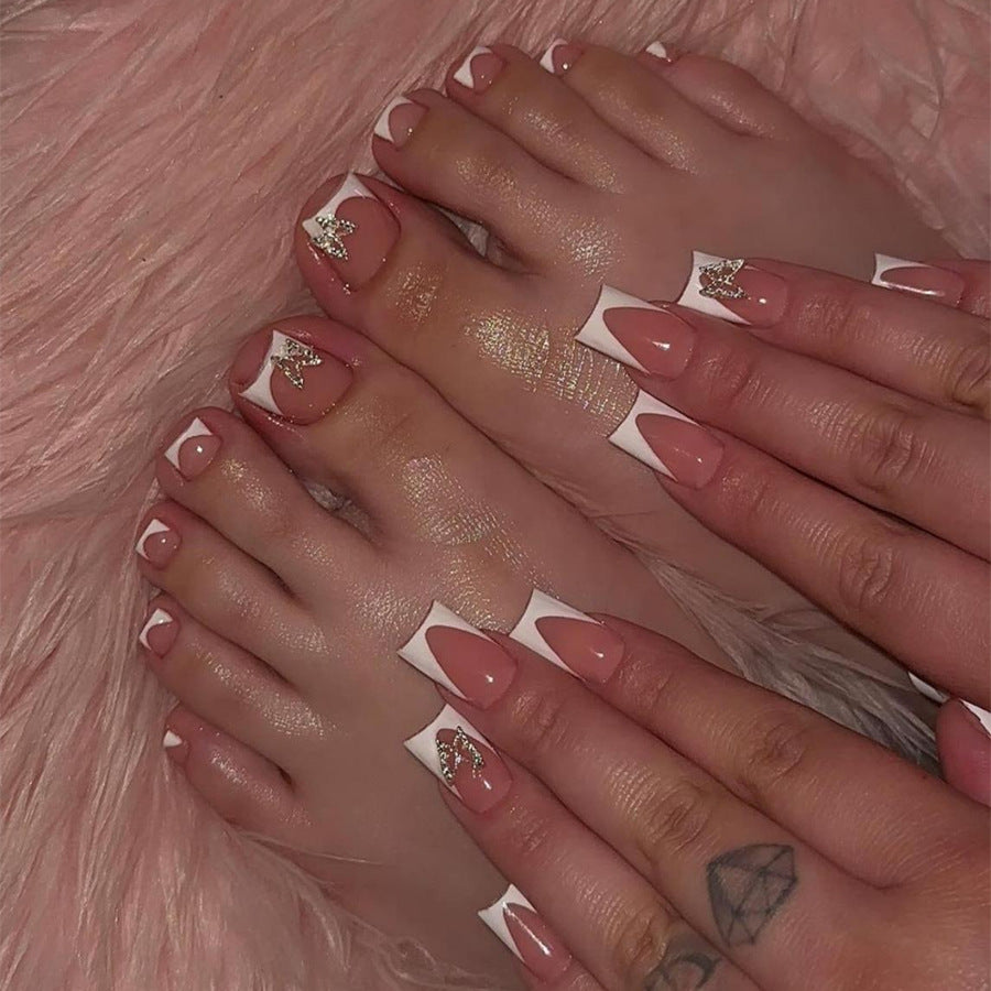 Artificial nail set with elegant French tip design and modern accents Kalsten