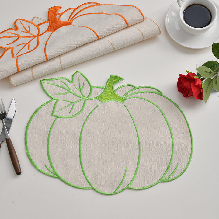 Seasonal table mat placemat made of linen in pumpkin silhouette with colorful embroidered border