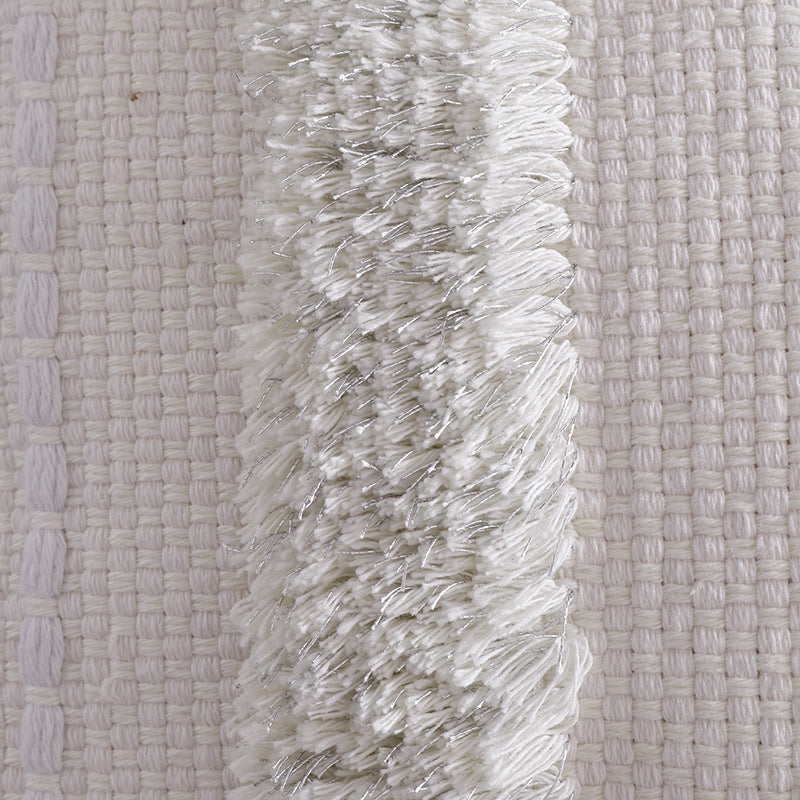 Structured living room carpet with 3D tufting and geometric diamond relief