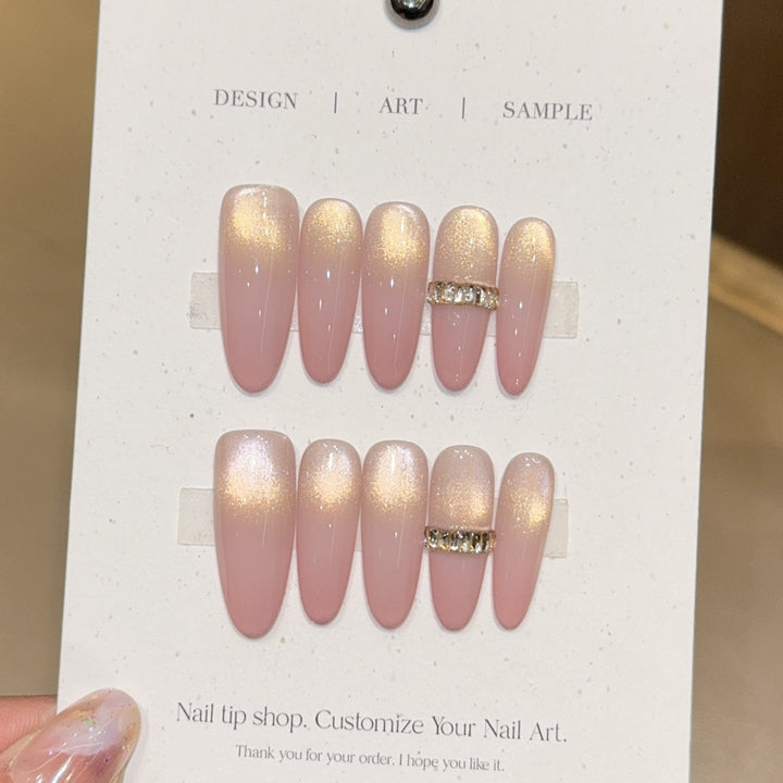 Glamorous artificial nails with elegant glitter and rhinestone application Kalsten