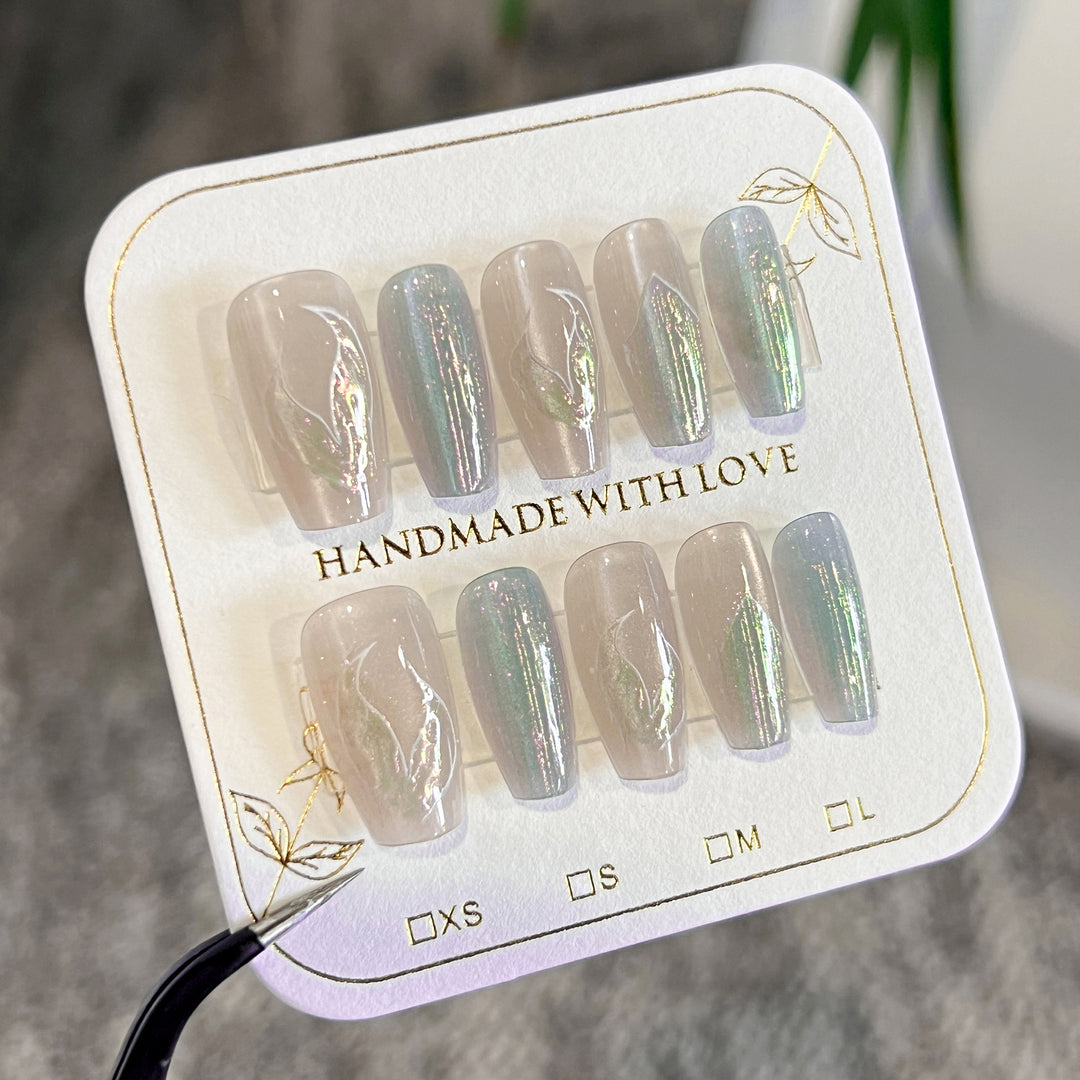 Artful artificial nails with transparent color gradient and delicate floral designs Kalsten