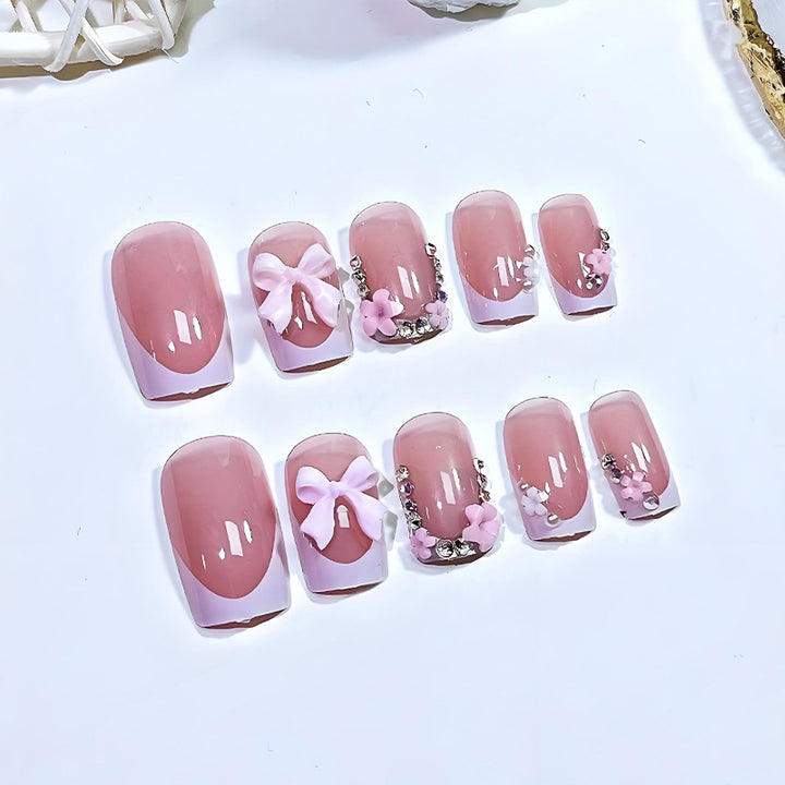 Artificial nail set with playful bows and elegant floral decorations Kalsten