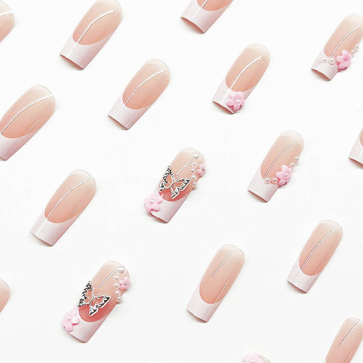 Artificial nail set with playful 3D flowers and glitter accents Kalsten
