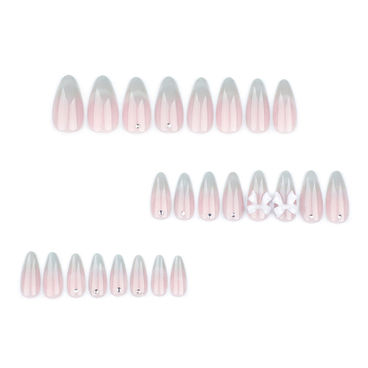 Elegant Stiletto Nails with Glitter and Bow Accents Kalsten