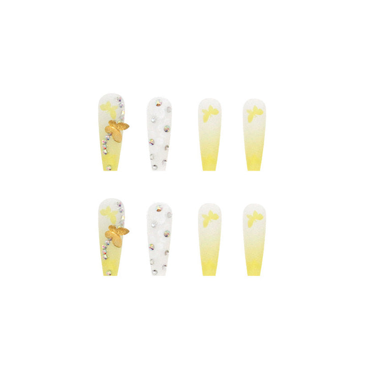 Artificial nail extensions with floral accents and rhinestones Kalsten