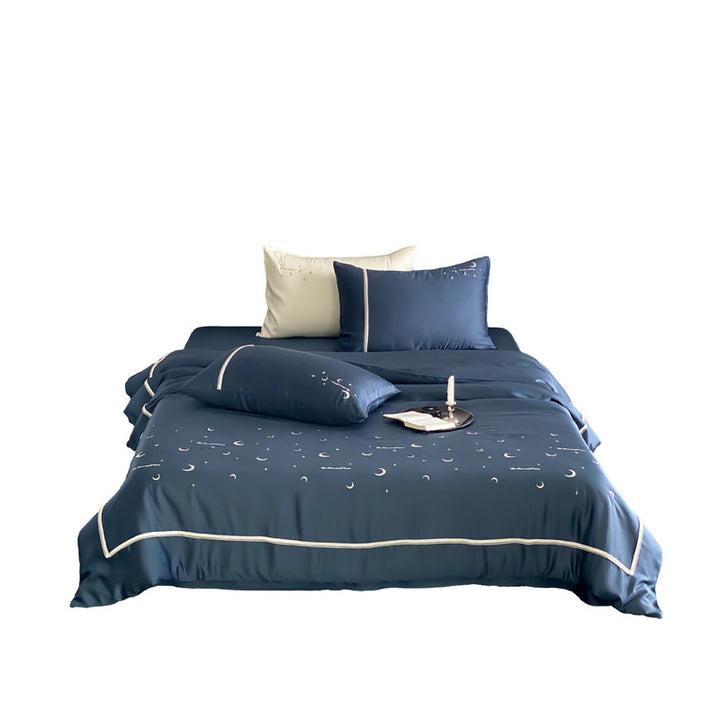 Silky shiny satin bed linen set with subtle moon and star motif