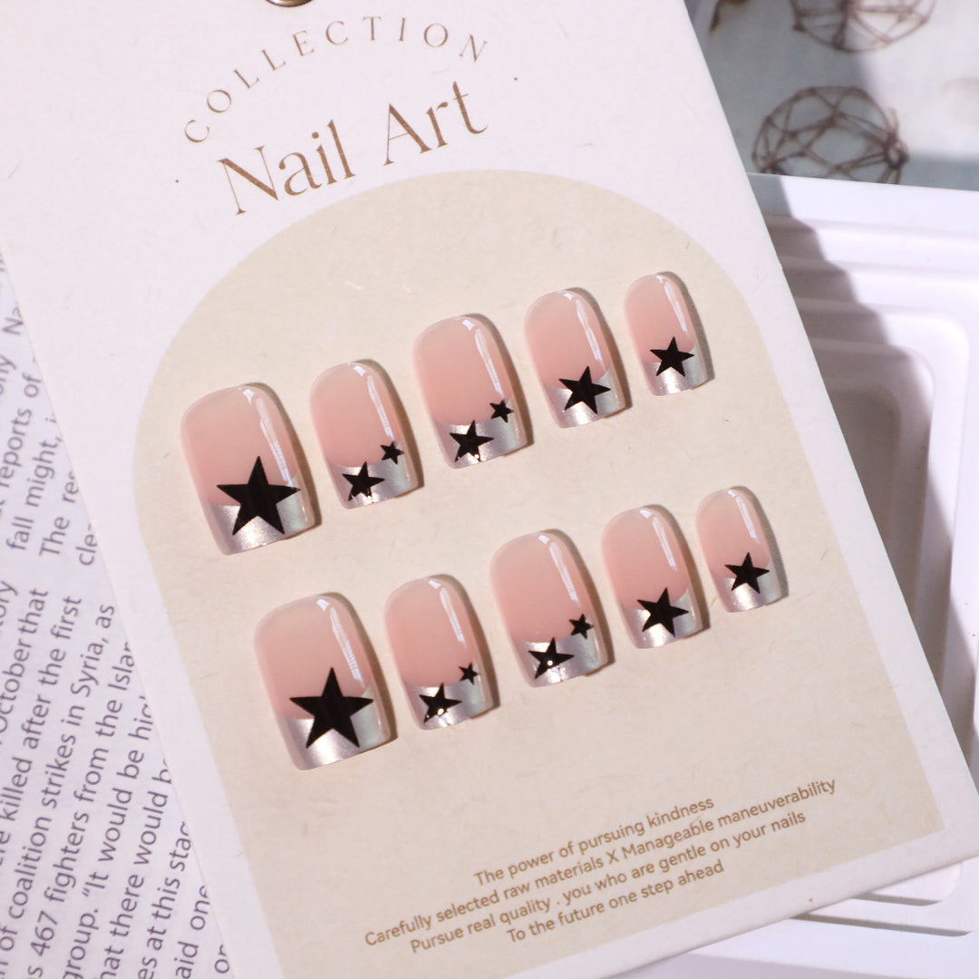 Sparkling nail art with stars and glitter accents Kalsten