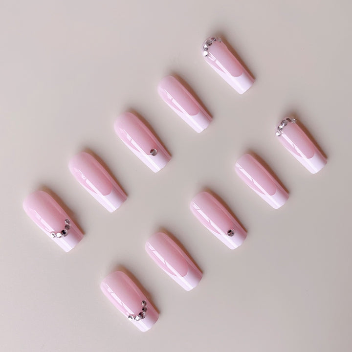 Acrylic nail set with elegant high-gloss finish and luxury rhinestone embellishments Kalsten