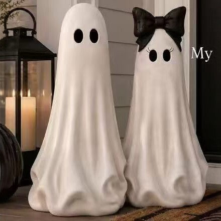 Playful ceramic decorative figure in ghost form with bow detail
