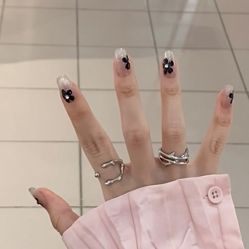 Artificial nail set with elegant flower design and glamorous accents Kalsten