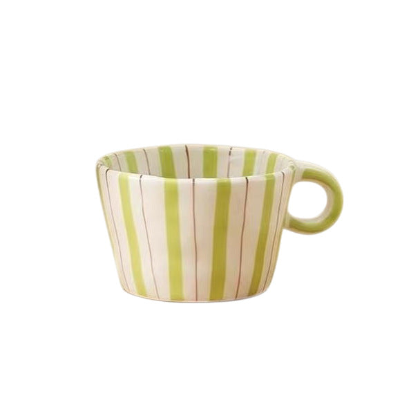 Ceramic coffee mug with ergonomic round handle and fine striped texture