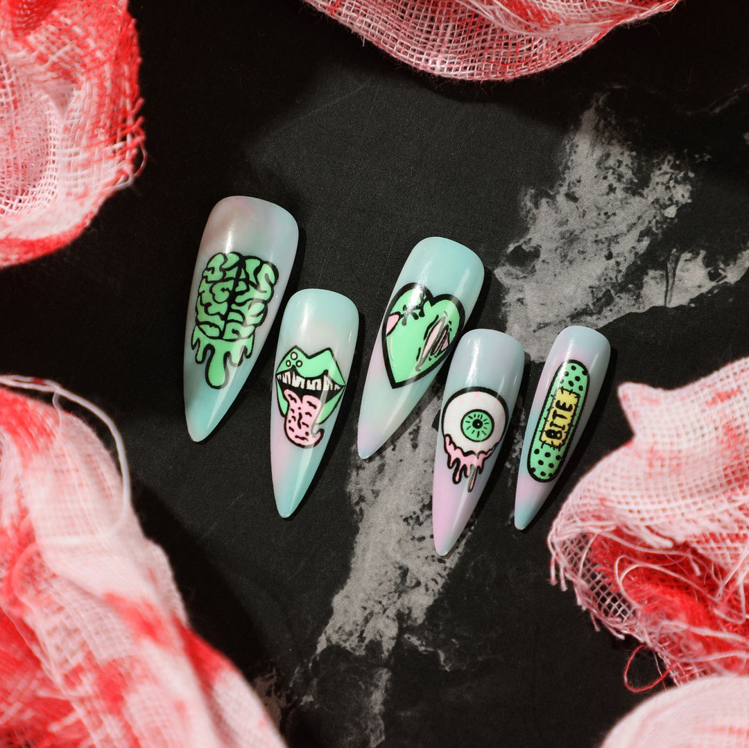 Artistic stiletto nails with creative designs and intricate detailing Kalsten