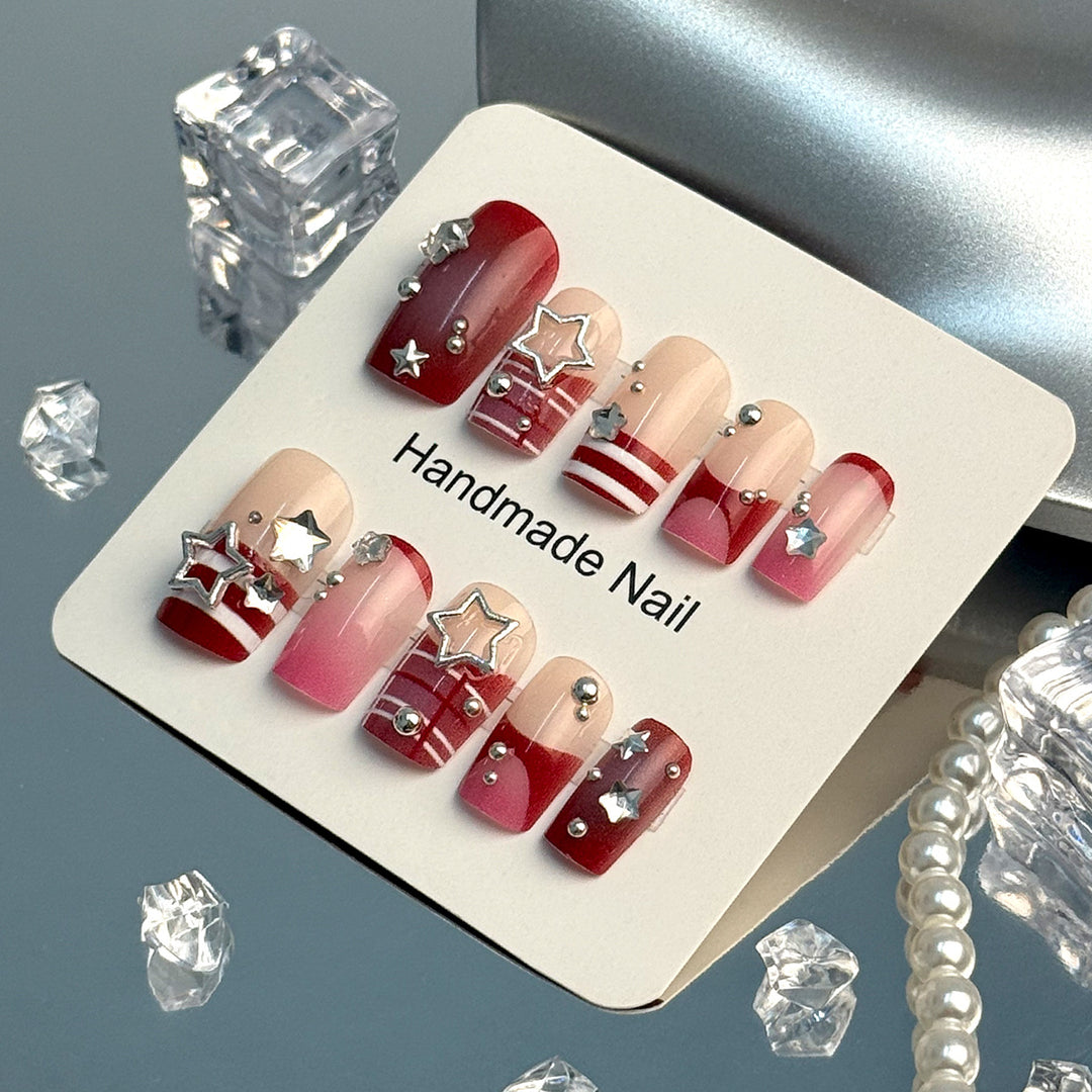 Artificial fingernails with handcrafted star decorations Kalsten