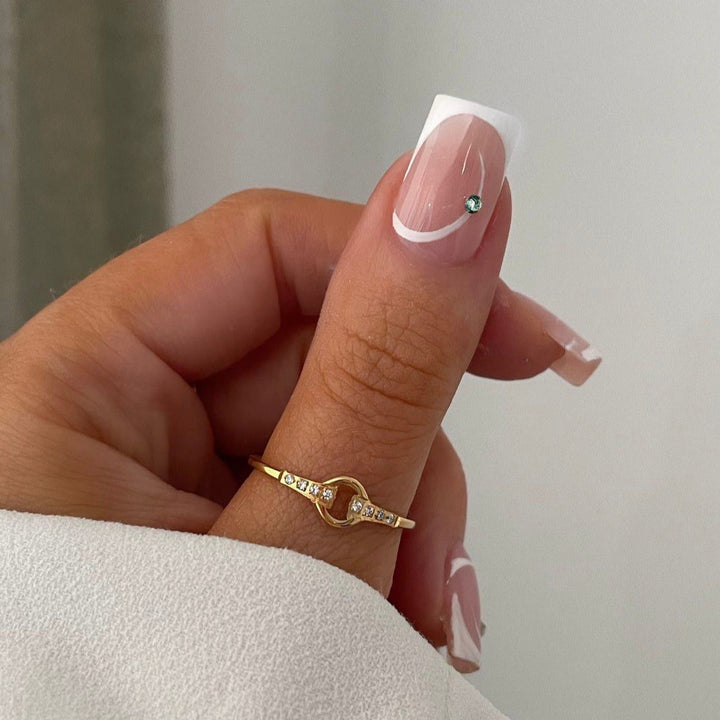 Artificial nail set with elegant French tips and glamorous rhinestone decorations Kalsten