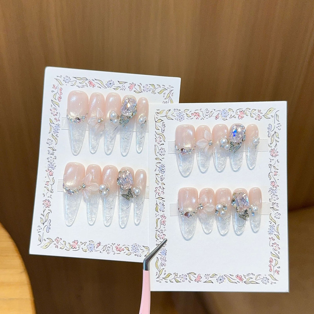 Artificial nails with delicate glitter and pearl decoration Kalsten
