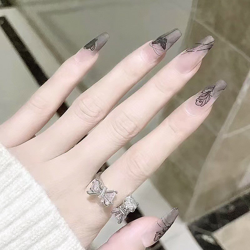 Artificial nail set with elegant flower design and delicate butterfly motifs Kalsten