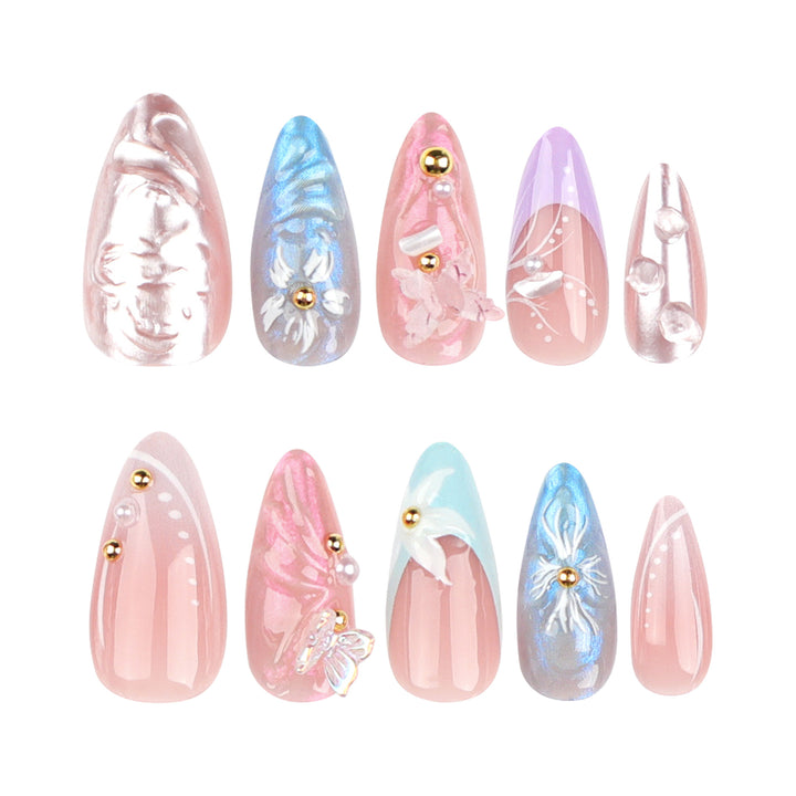 Artistic stiletto nails with delicate flower and glitter embellishments Kalsten
