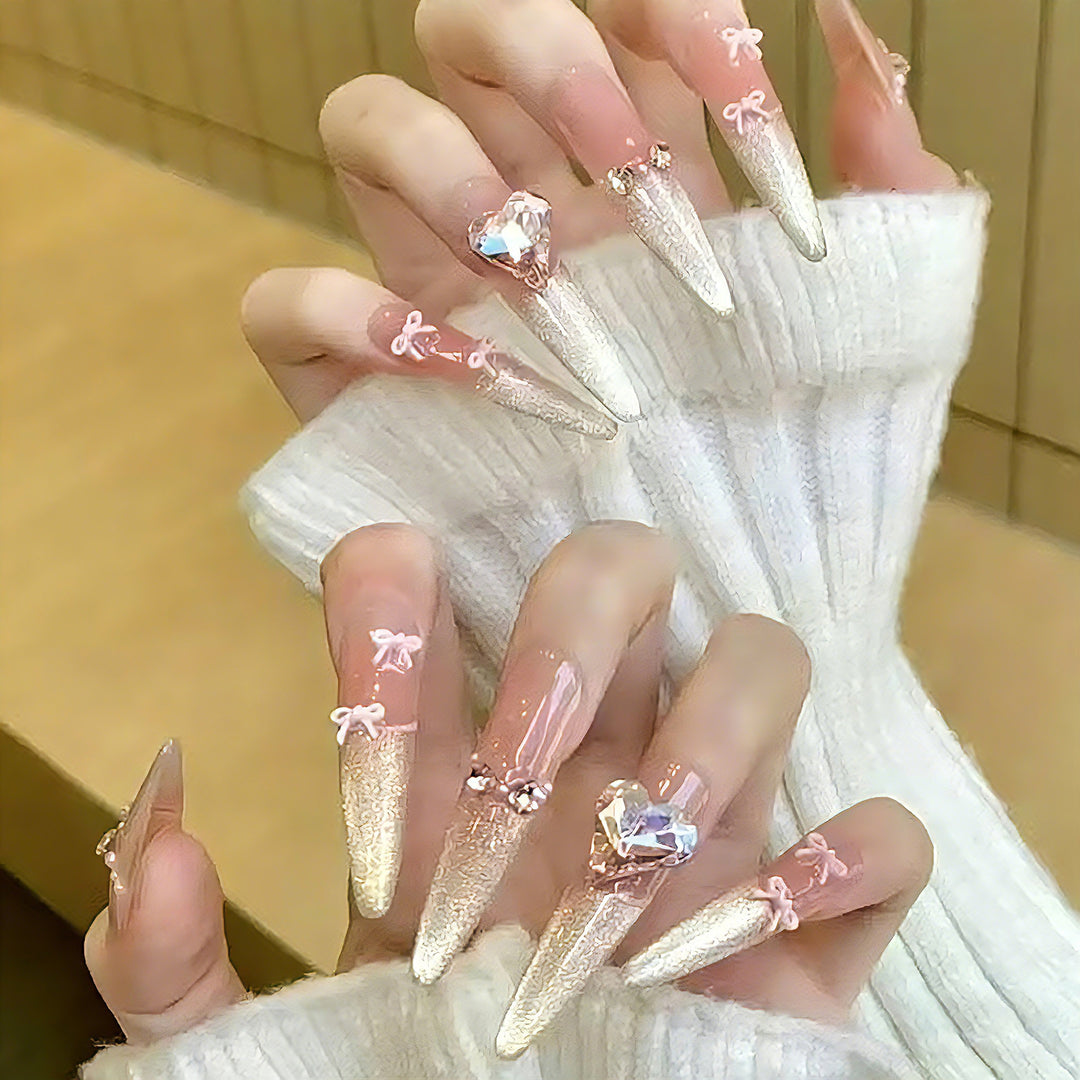 Art nail set with sparkling tips and delicate bow decorations Kalsten