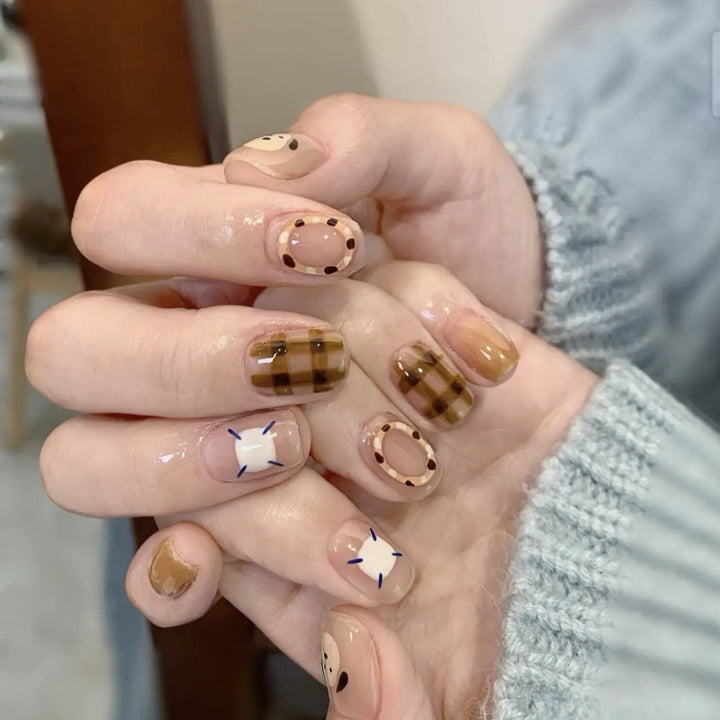 Playful artificial nails with cute animal and pattern accents Kalsten