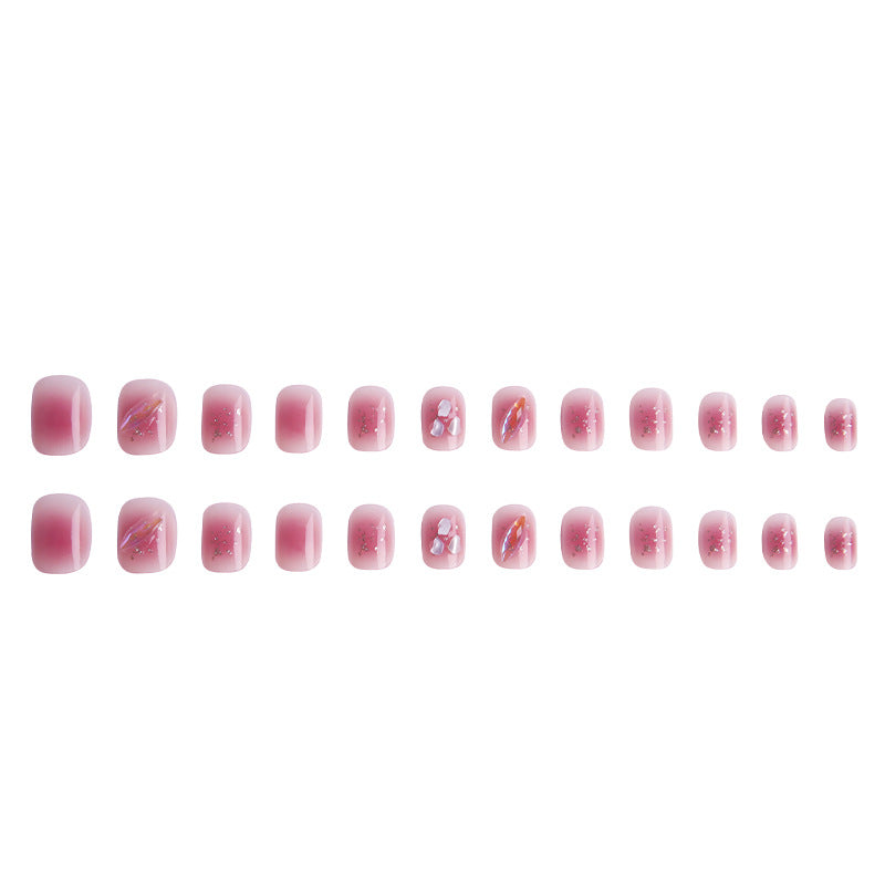 Artificial nails with delicate glitter design and floral accent Kalsten