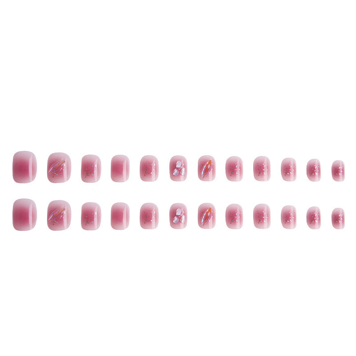 Artificial nails with delicate glitter design and floral accent Kalsten