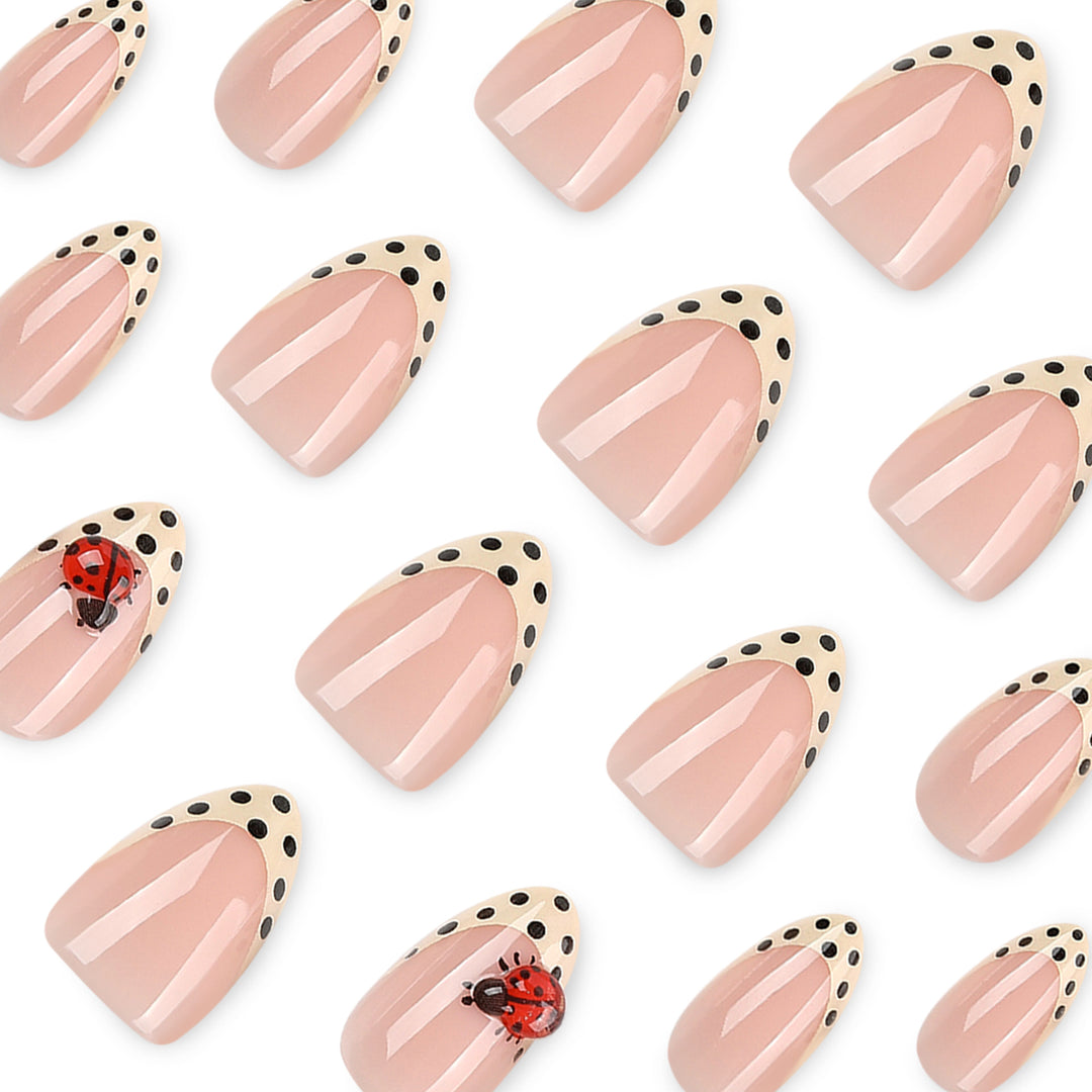 Artful nail art with ladybug motif and polka dots Kalsten