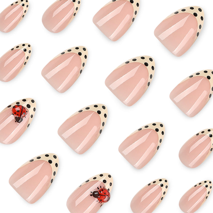 Artful nail art with ladybug motif and polka dots Kalsten