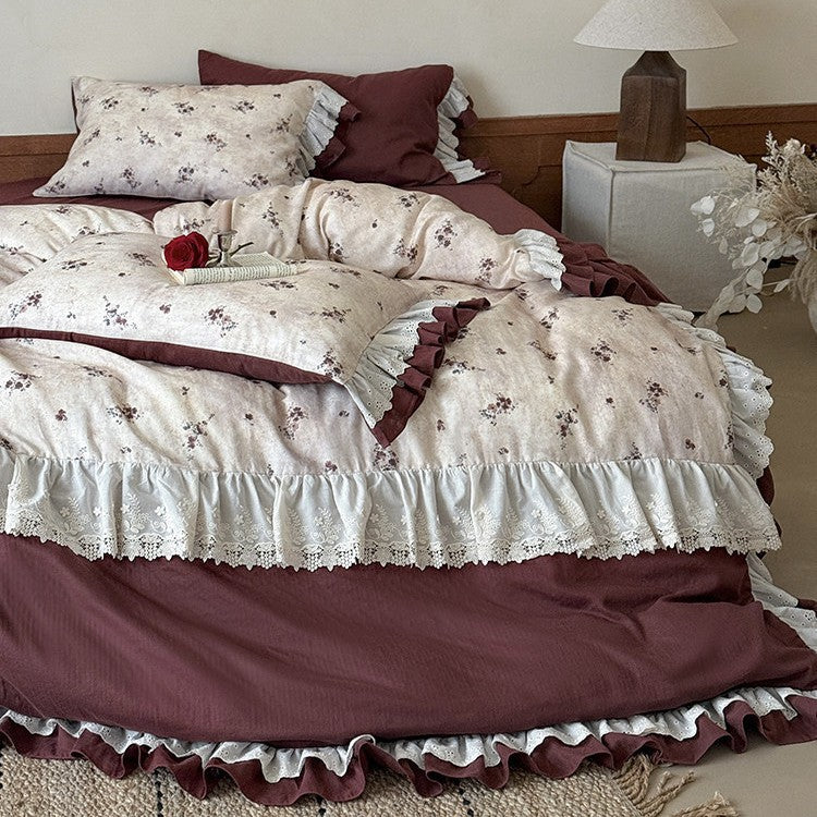 Romantic bed linen set with lace trim, ruffles, and fine floral print