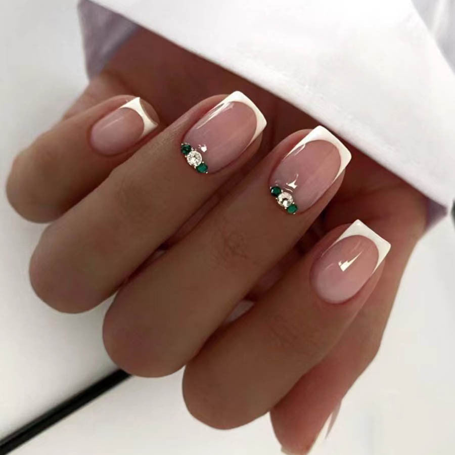 Art nail set with elegant French design and glittering accents Kalsten