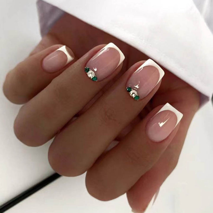 Art nail set with elegant French design and glittering accents Kalsten