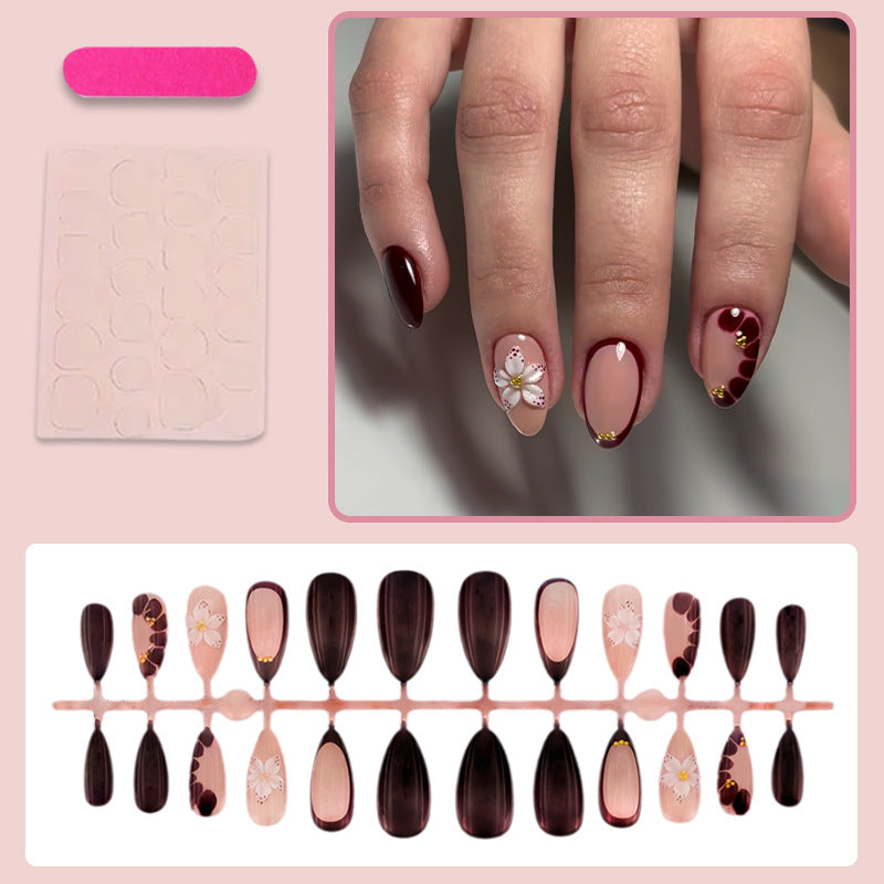Acrylic nail set with elegant floral patterns and glamour accents Kalsten