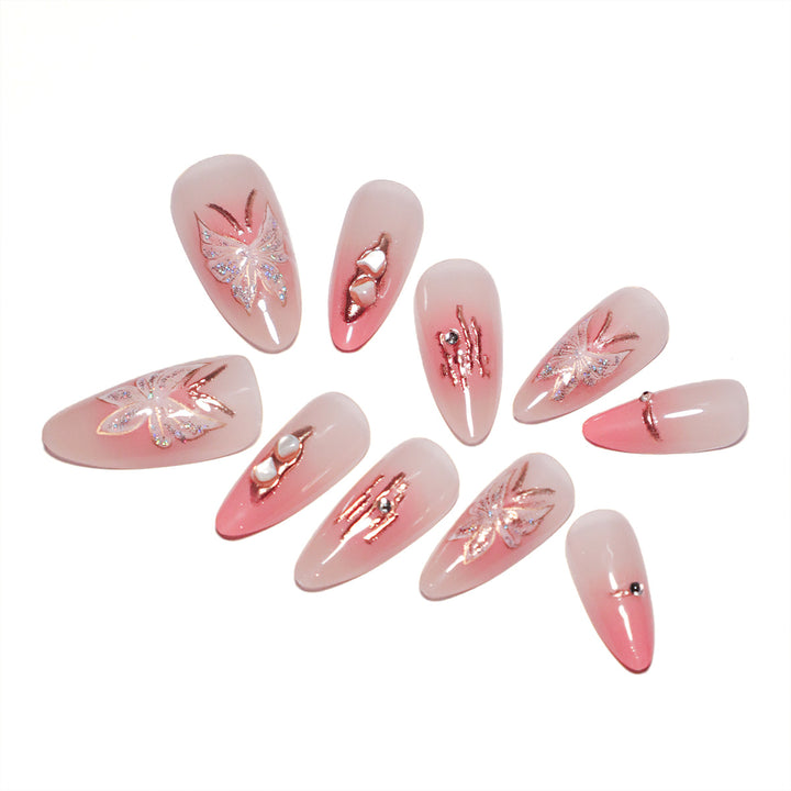 Artificial nail extensions with floral motifs and glitter accents Kalsten